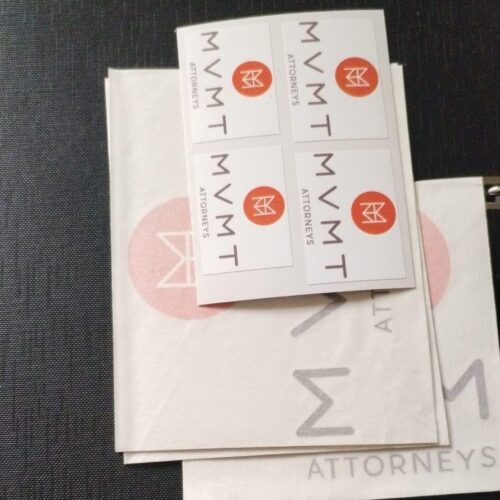 Image shows a pile of vinyl stickers printed by brandxellence and ready to use