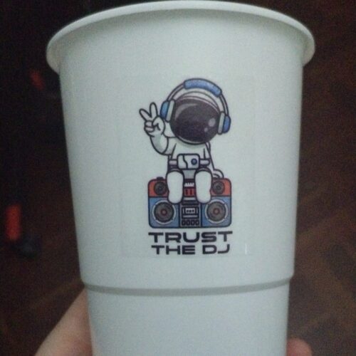 Image shows a vinyl sticker applied to a drinking cup for custom branded event cups - vinyl stickers printing - printed by BrandXellence